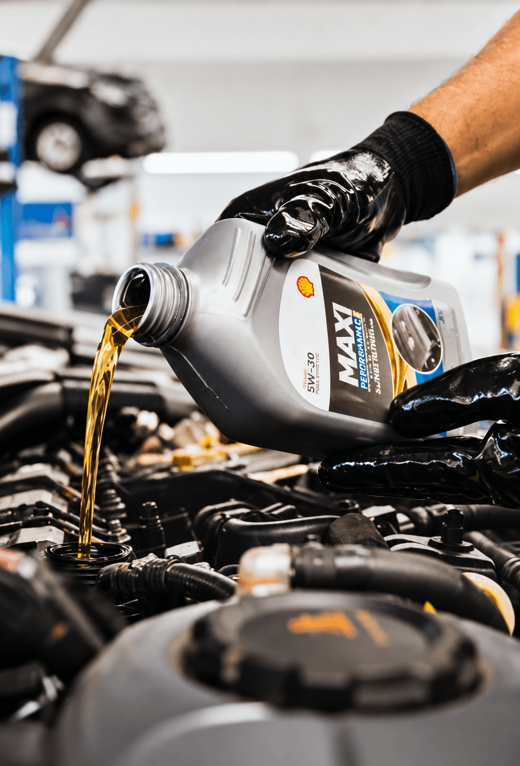 Mechanic working on an open engine bay